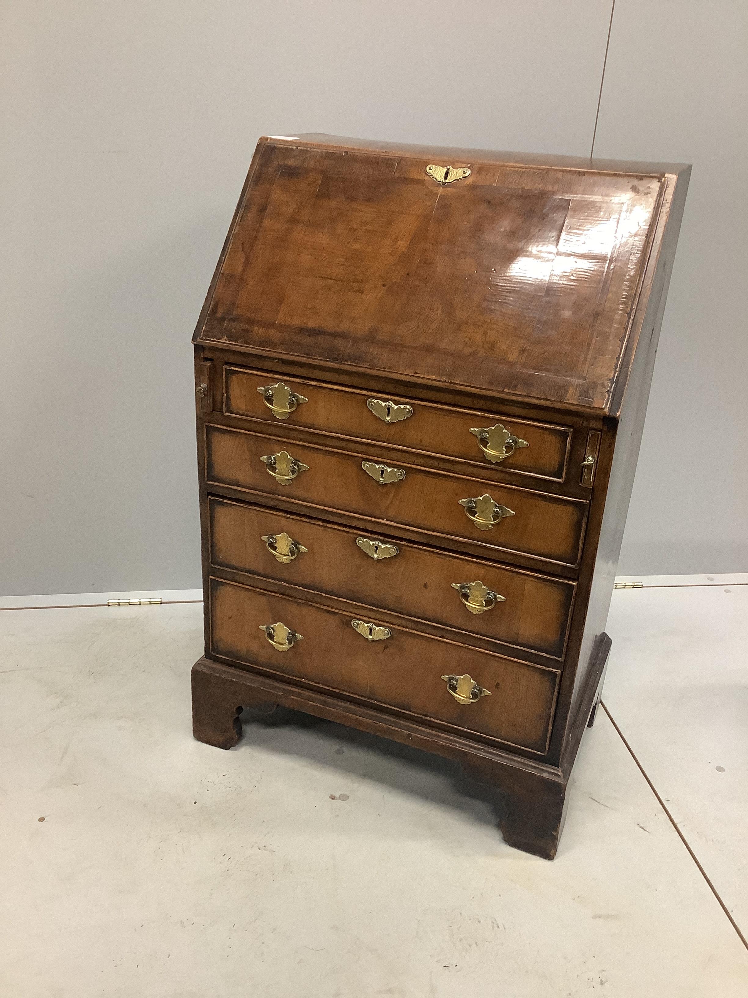 A small George I style feather banded walnut bureau, width 59cm, depth 39cm, height 94cm